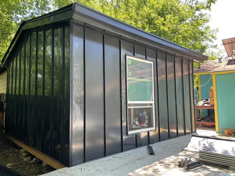 Black standing seam metal wall panels for Roof Inspection in Lake City